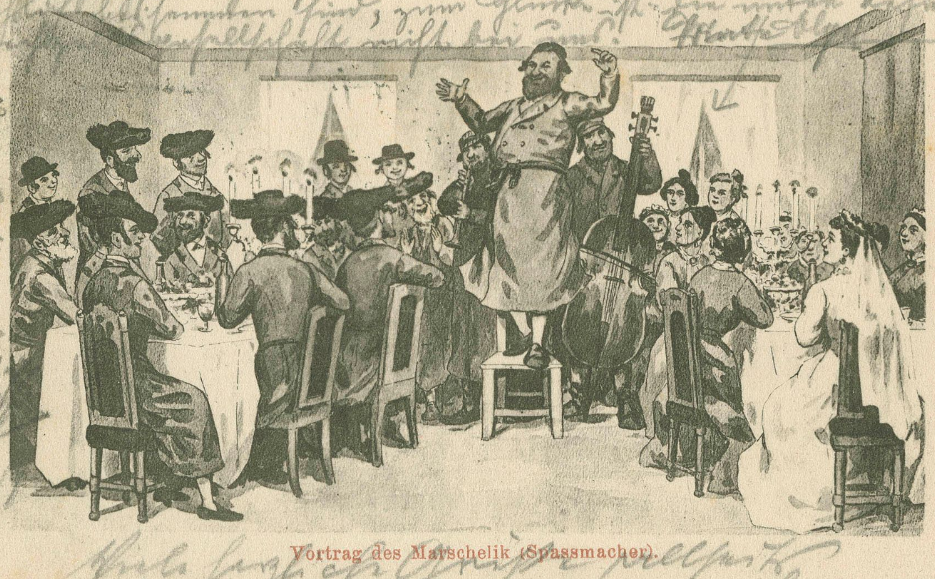 A 1903 postcard showing a badkhn addressing a wedding